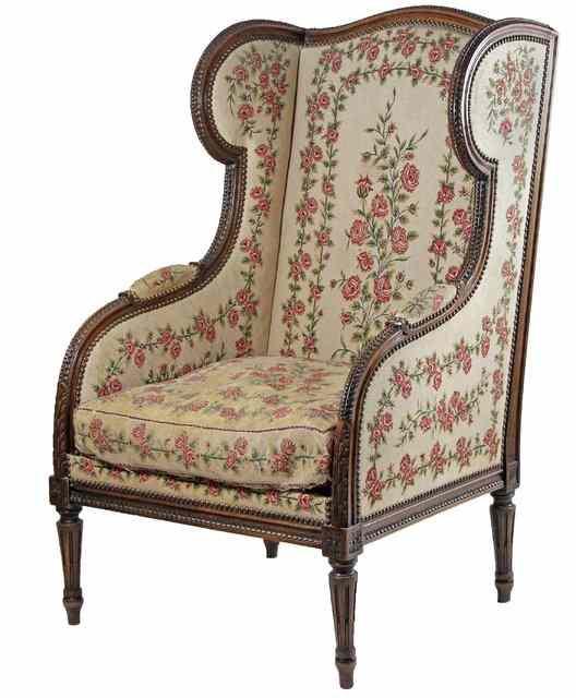 Appraisal: A Louis XVI style wing armchair with carved beech wood