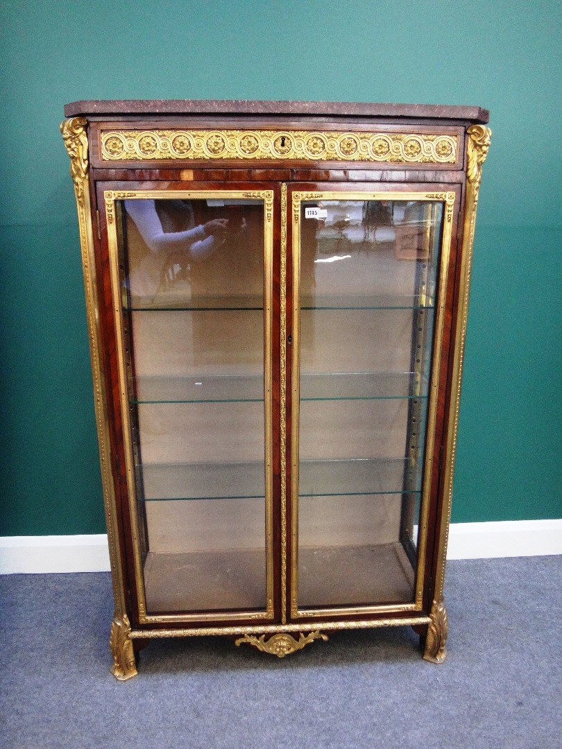 Appraisal: A Louis XV style vitrine the canted rectangular faux marble