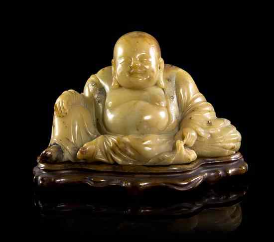 Appraisal: A Chinese Carved Soapstone or Steatite Model of Buddha of