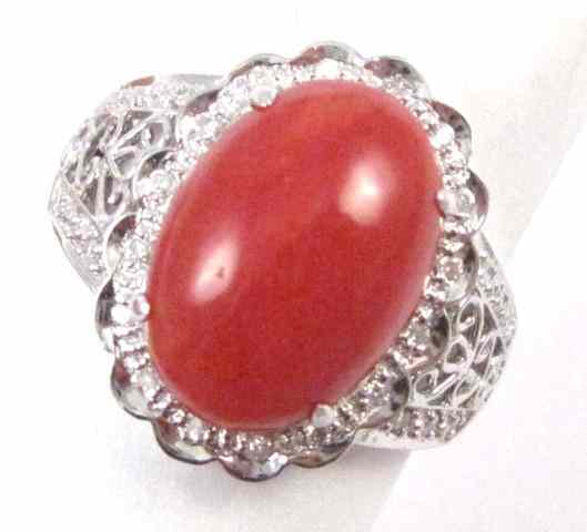 Appraisal: CORAL DIAMOND AND FOURTEEN KARAT GOLD RING round-cut diamonds are