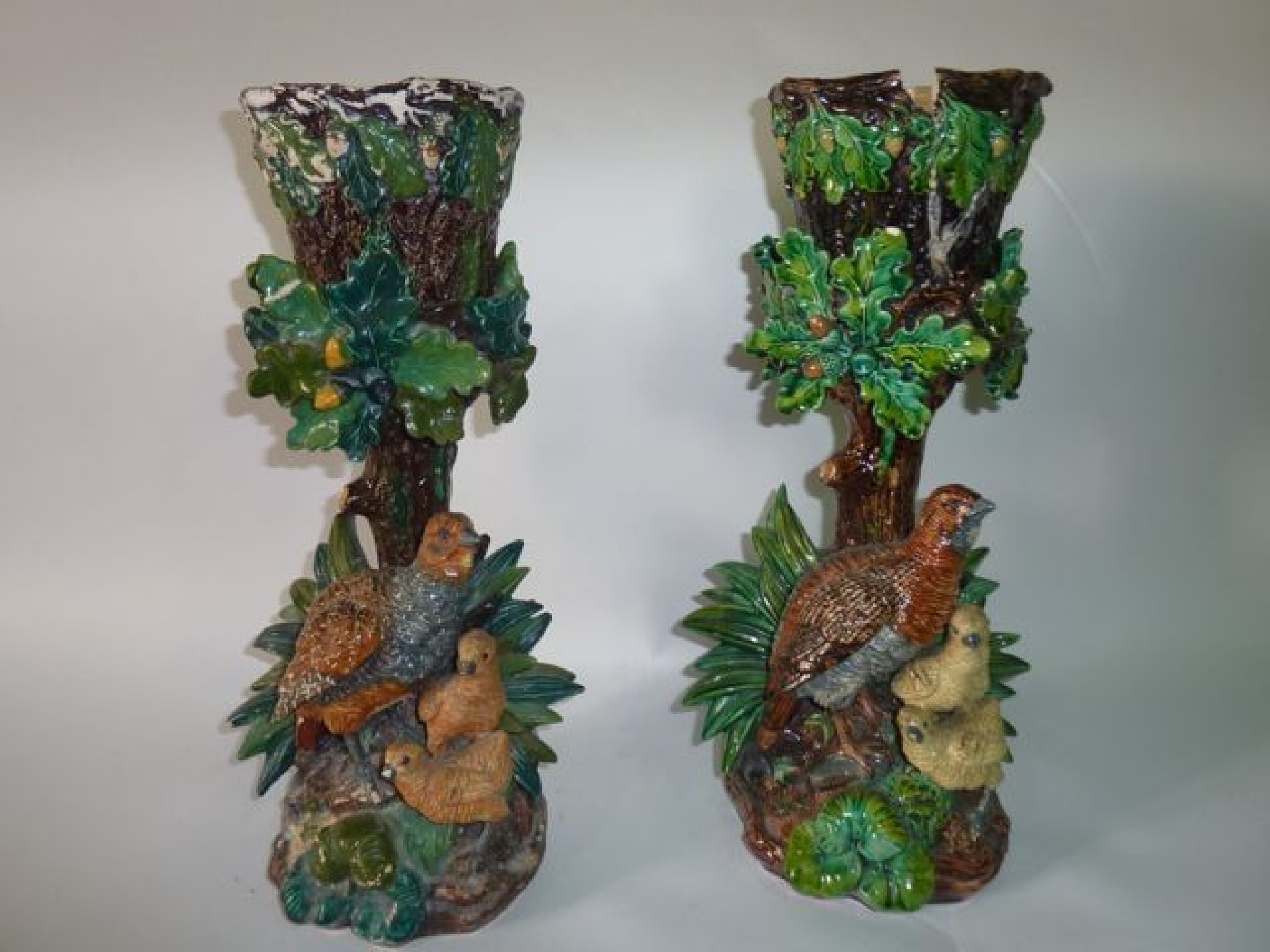 Appraisal: A pair of Hugo Lonitz majolica stands circa depicting a