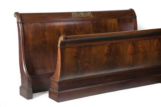 Appraisal: HENKEL HARRIS SLEIGH BED American th century mahogany Branded label