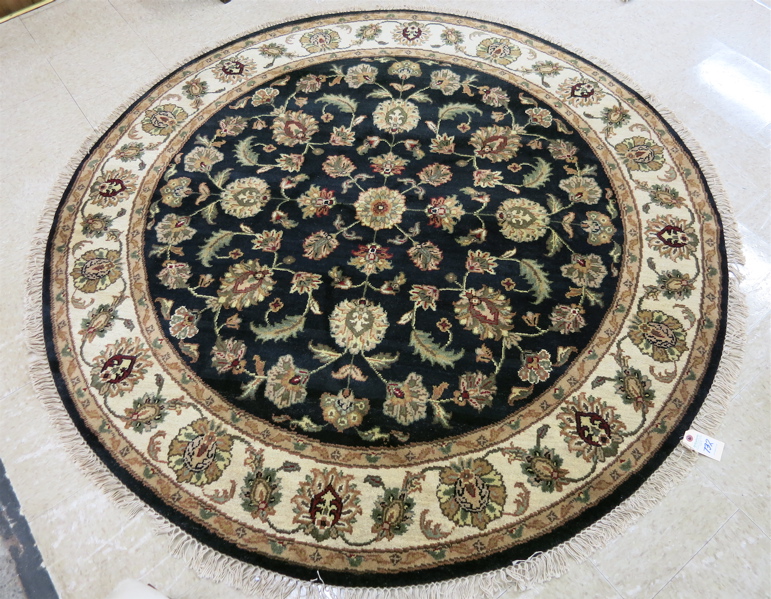 Appraisal: ROUND ORIENTAL AREA RUG Indo-Persian hand knotted in an overall