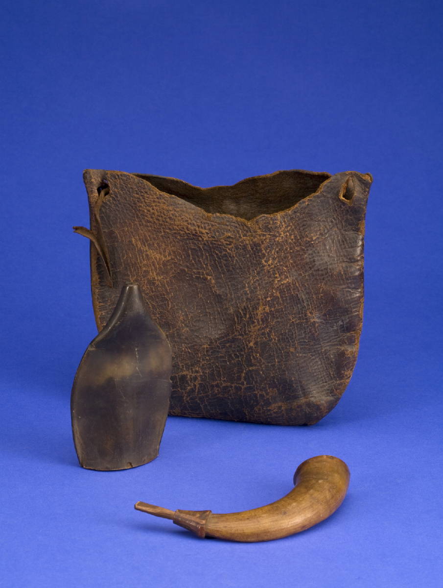 Appraisal: THREE HUNTING RELATED ITEMS A leather pouch a small powder