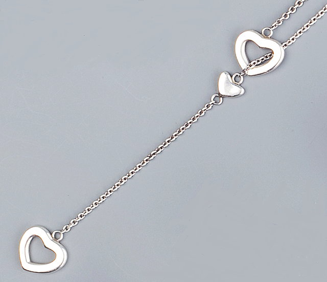 Appraisal: A LARIAT NECKLACE BY TIFFANY CO the trace-link chain spaced