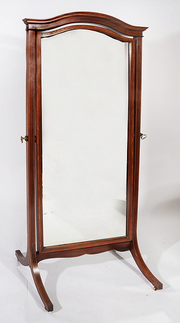 Appraisal: A MAHOGANY CHEVAL MIRROR by Howard Sons Ltd with arching