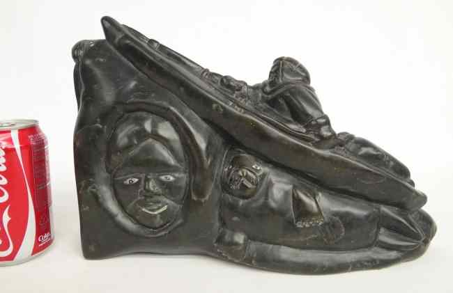 Appraisal: Inuit Eskimo sculpture man in Kayak with face and reclining