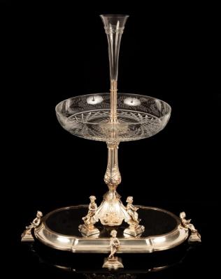 Appraisal: A silver plated table centrepiece surmounted by a trumpet-shaped glass