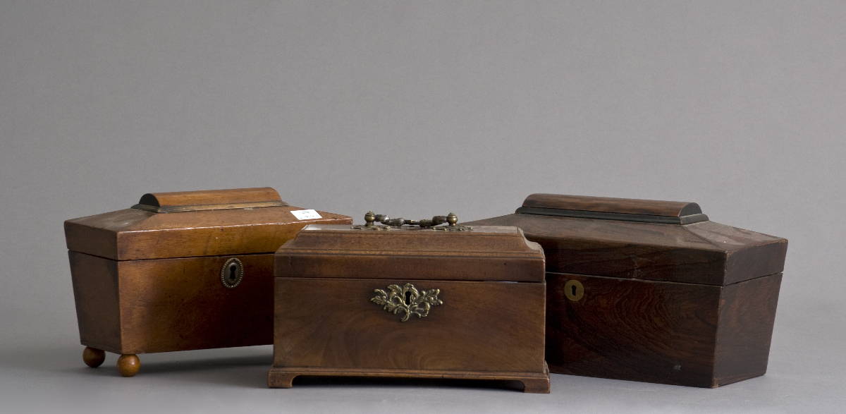 Appraisal: GEORGIAN MAHOGANY TEA CADDY AND TWO REGENCY COFFIN SHAPED EXAMPLES