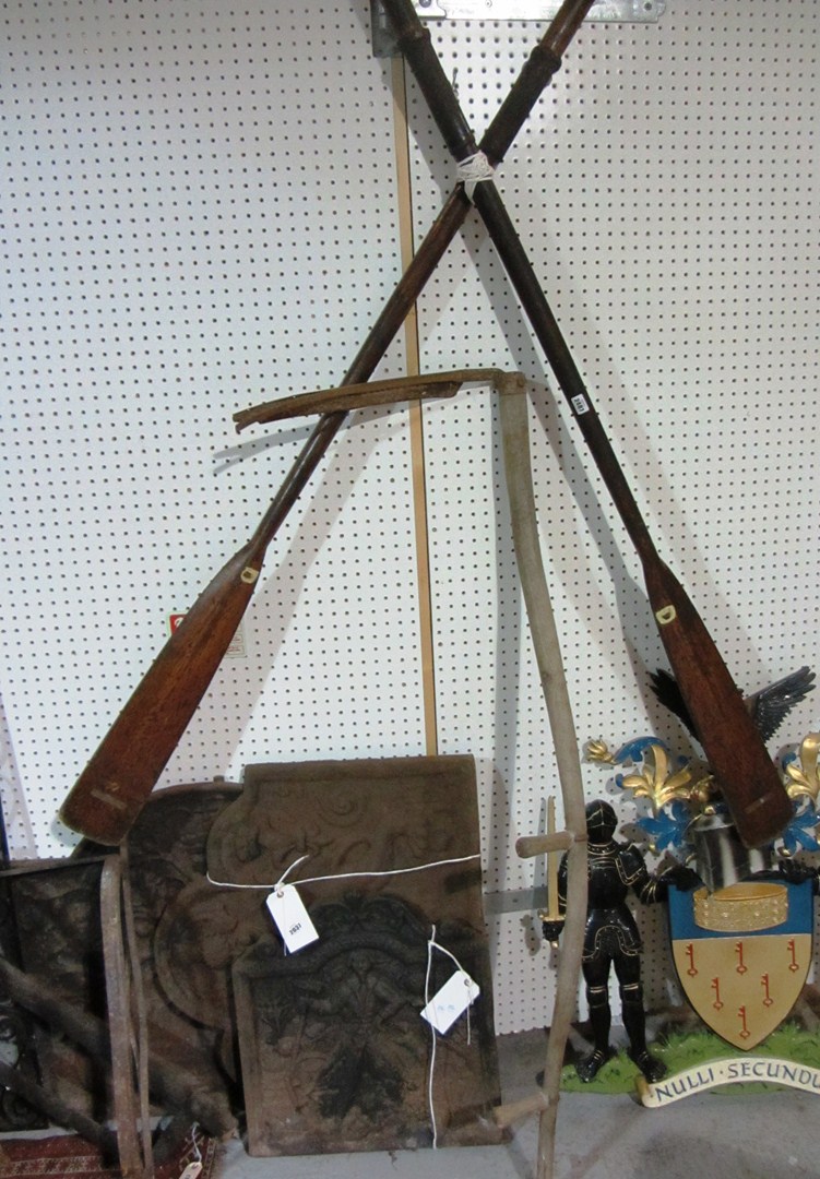 Appraisal: A pair of vintage oars and a sythe