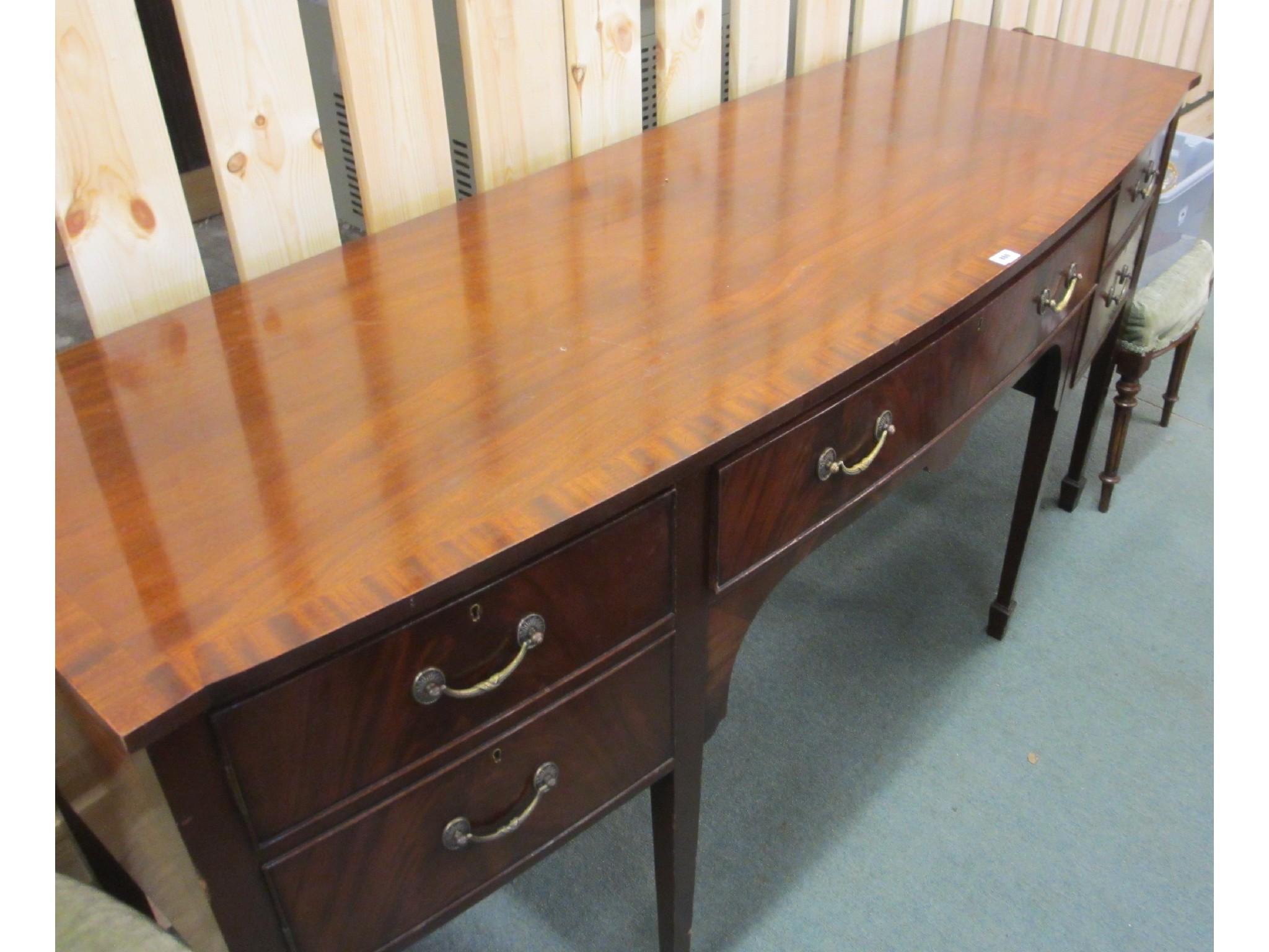 Appraisal: A mahogany bow front sideboard