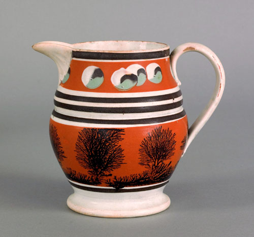 Appraisal: Mocha pitcher th c with seaweed and cat's eye decoration