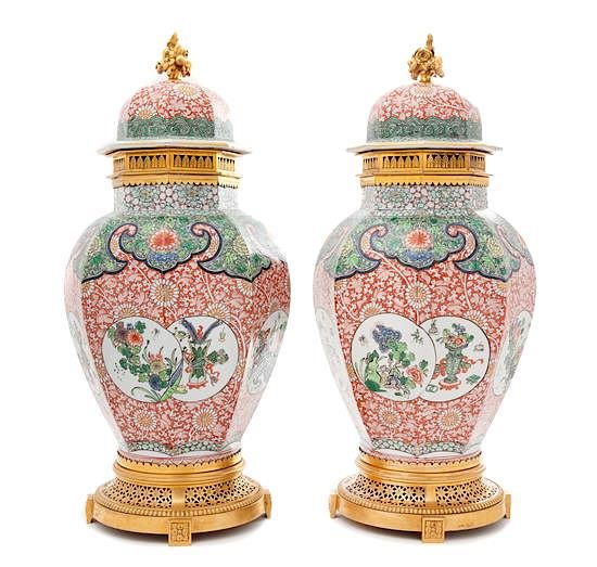 Appraisal: A Pair of French Gilt Bronze Mounted Porcelain Covered Vases