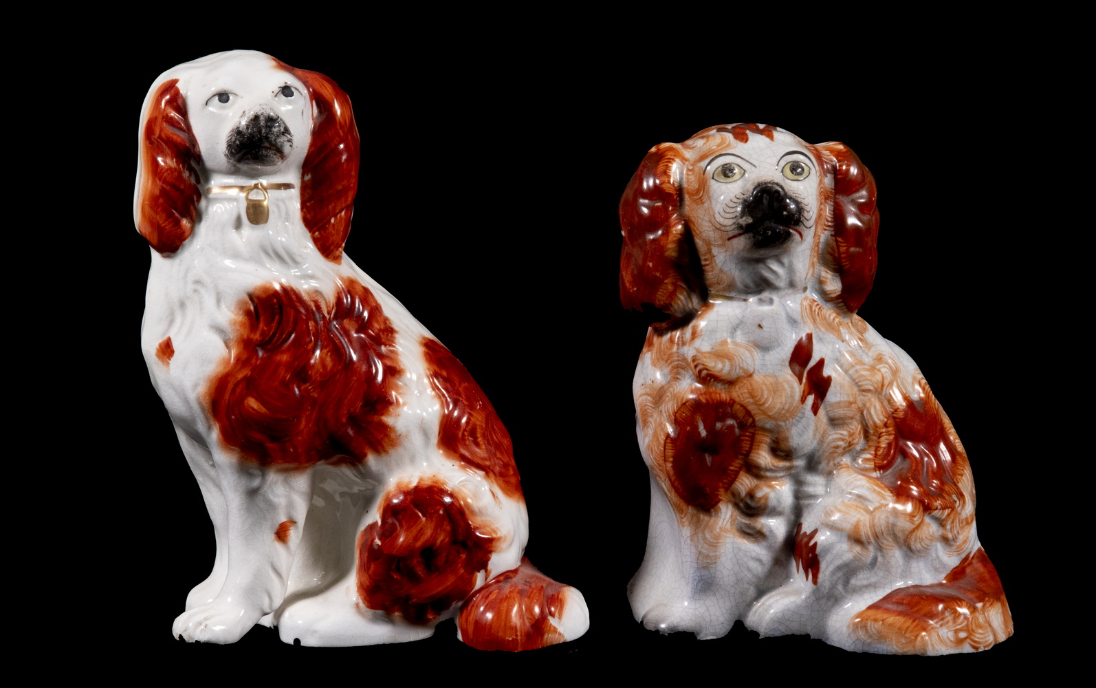 Appraisal: STAFFORDSHIRE SEATED SPANIEL FIGURINES English Pottery King Charles Spaniel Figures