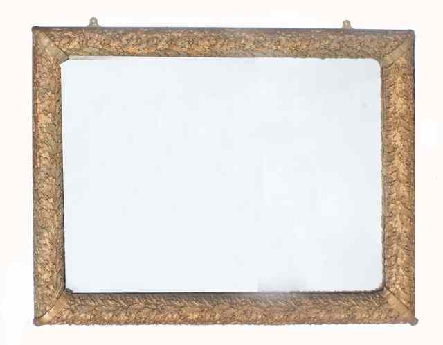 Appraisal: A RECTANGULAR WALL MIRROR the gilt cushion frame moulded with