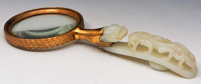 Appraisal: A Chinese white jade hook th Centurymounted as a magnifying