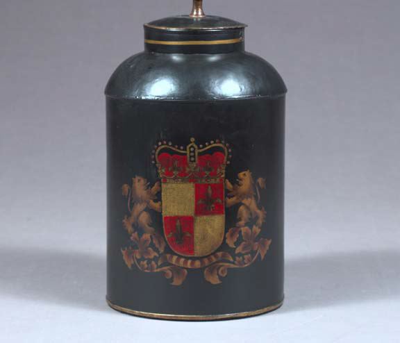 Appraisal: English Parcel-Gilt Black Tole-Peinte Tea Canister of cylindrical form in