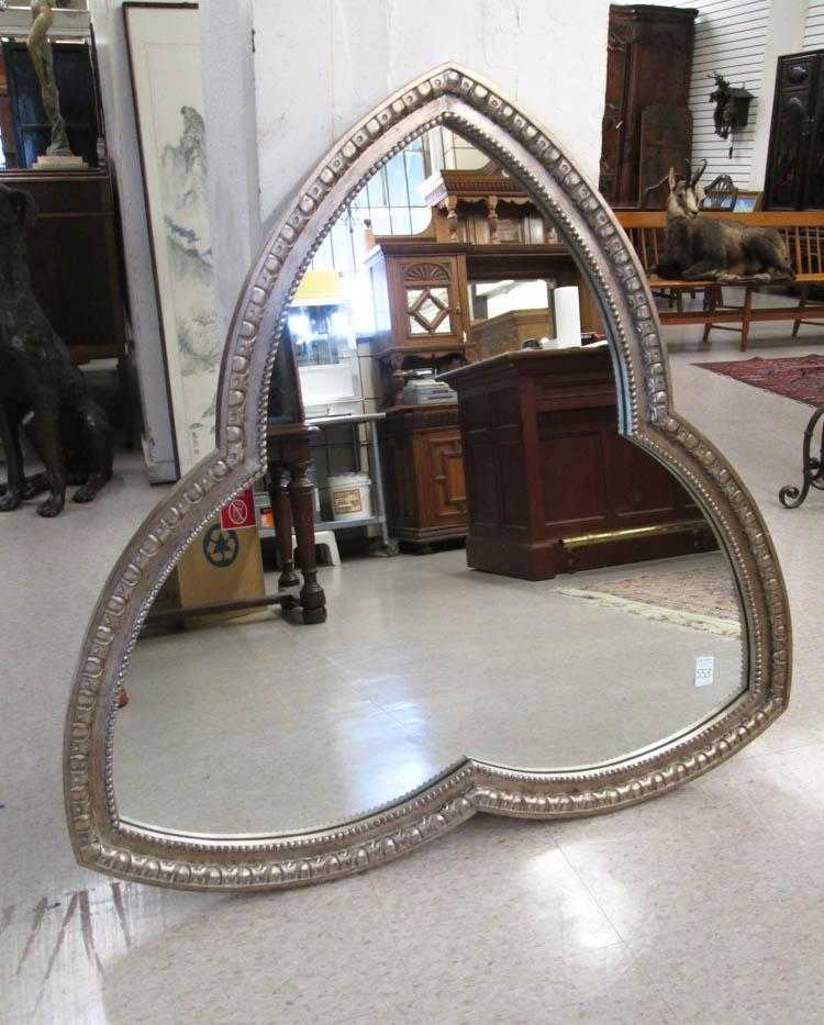 Appraisal: TREFOIL-SHAPED WALL MIRROR Gothic style antiqued and silver-gilt wood frame