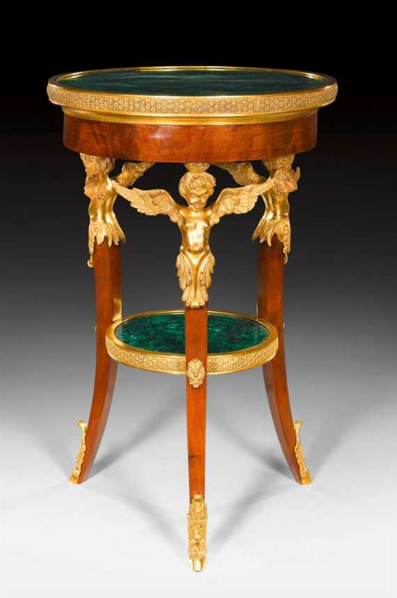 Appraisal: ROUND GUERIDON AUX ANGELOTS WITH MALACHITE TOP Louis XVI style