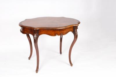 Appraisal: An Edwardian walnut centre table cross banded and fitted a