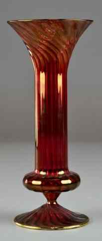 Appraisal: Victorian Cranberry Glass Trumpet VaseDecorated with raised scrolled ribs with