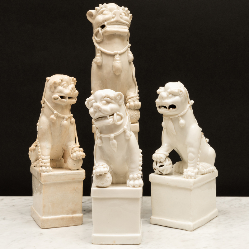 Appraisal: Group of Four Blanc de Chine Porcelain Buddhistic Lion Joss