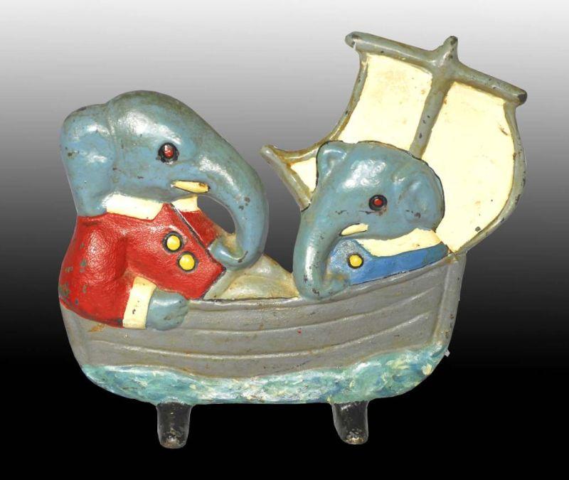 Appraisal: Cast Iron Babar and Arthur in a Boat Doorstop Description