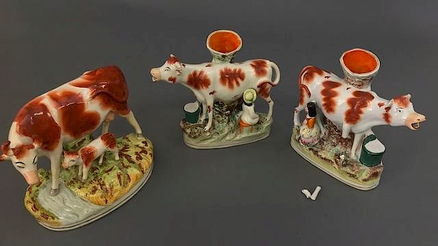 Appraisal: Pair of Cow Spill Vases Cow Calf Figure Pair of