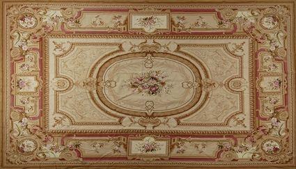 Appraisal: NEEDLEWORK AUBUSSON CARPET Centered by a colorful floral spray within