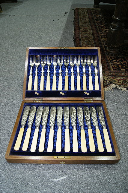 Appraisal: A CASED SET OF TWELVE FISH KNIVES and forks with