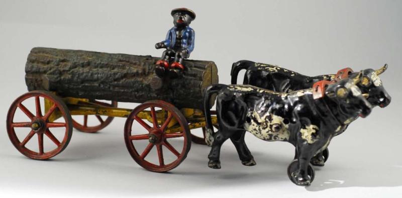 Appraisal: Cast Iron Hubley Oxen-Drawn Log Wagon Description Minor touchup to