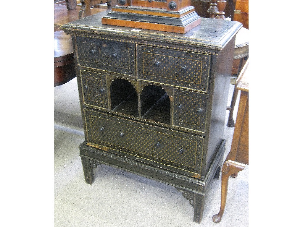 Appraisal: Chinese ebonised and gilt decorated chest on stand