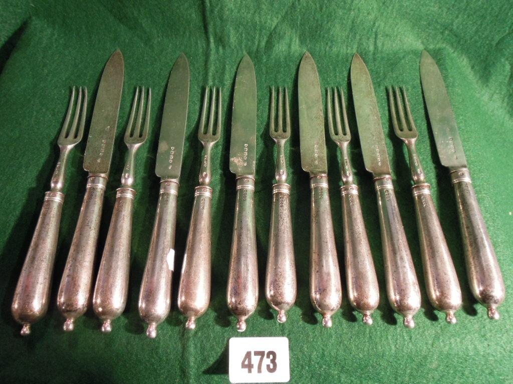 Appraisal: A set of Victorian silver knives and forks settings with