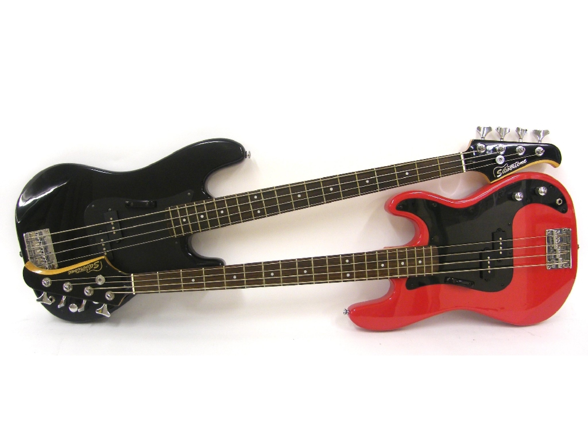 Appraisal: Two Silvertone Precision style bass guitars one with black finish