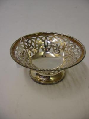 Appraisal: AN EDWARDIAN SWEETMEAT DISH Walker Hall Sheffield of pierced circular