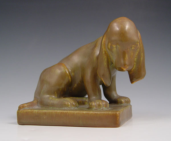 Appraisal: ROOKWOOD POTTERY HOUND DOG FIGURAL BOOKEND Single bookend Measures ''