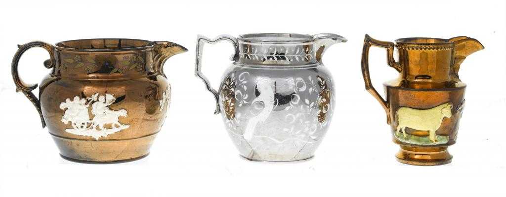 Appraisal: A PEARLWARE JUG with silver resist decoration of birds on