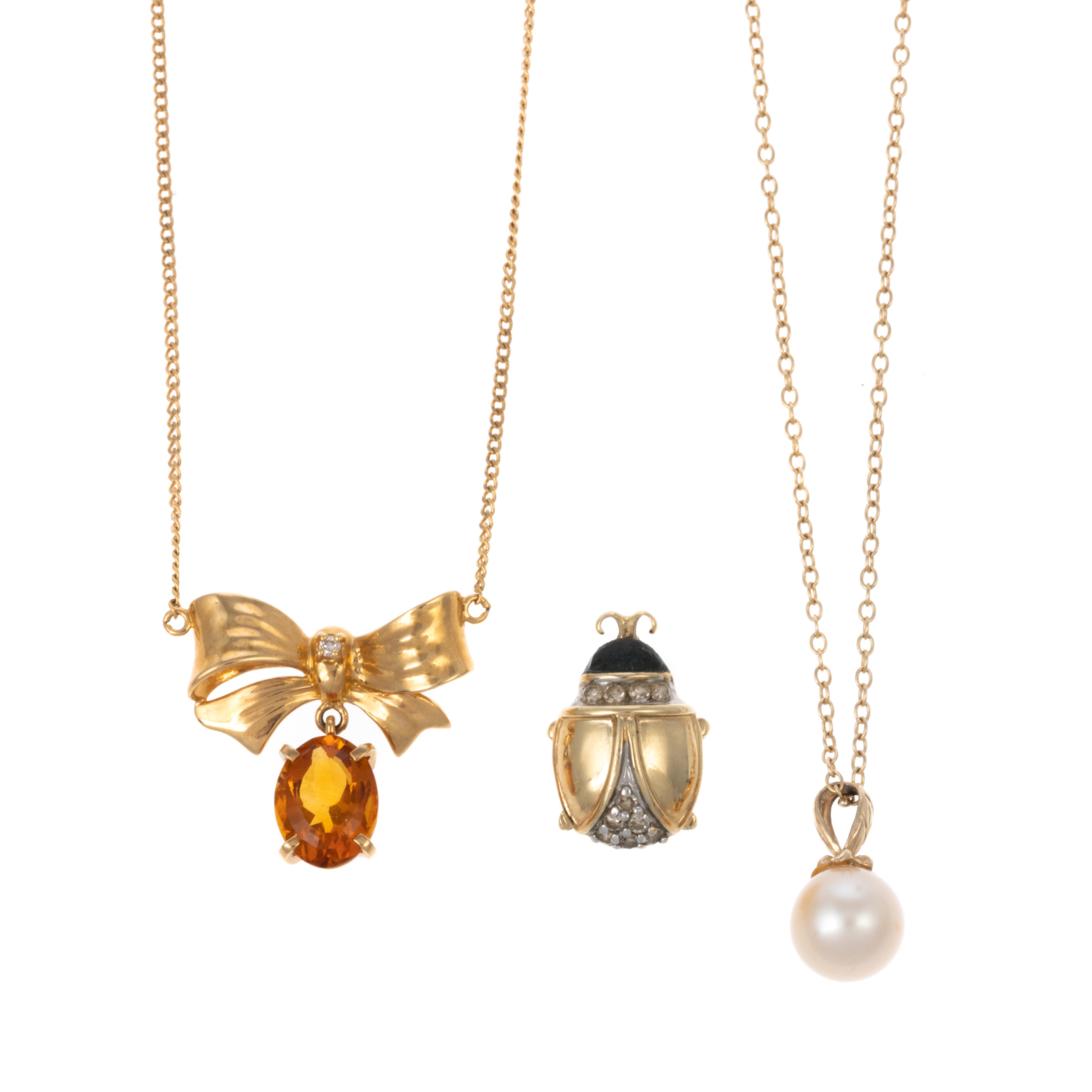 Appraisal: A TRIO OF GOLD PEARL CITRINE LADY BUG PENDANTS K