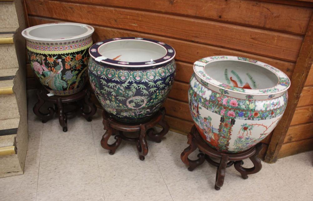 Appraisal: THREE CHINESE ENAMELED PORCELAIN 'FISHBOWL' PLANTERS ON STANDS one with