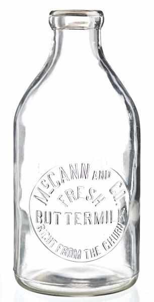 Appraisal: McCann Co Half-Gallon Buttermilk Bottle Description Nice clear bottle with