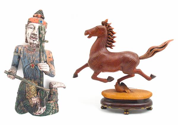 Appraisal: A group of four South East Asian carved and paint