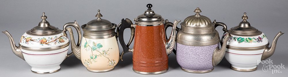 Appraisal: Five graniteware tea and coffee pots Five graniteware tea and