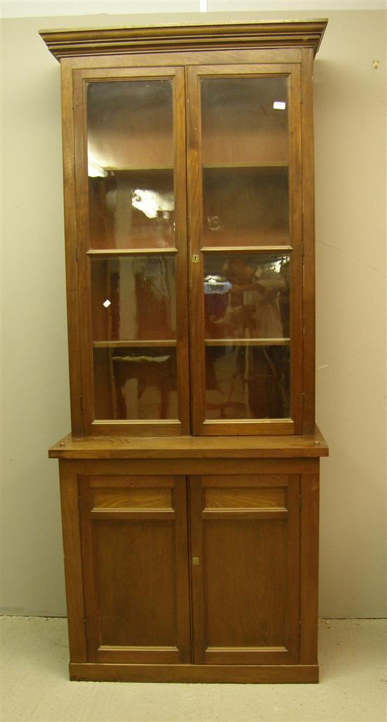 Appraisal: Early th century mahogany glazed bookcase with cupboard and drawer