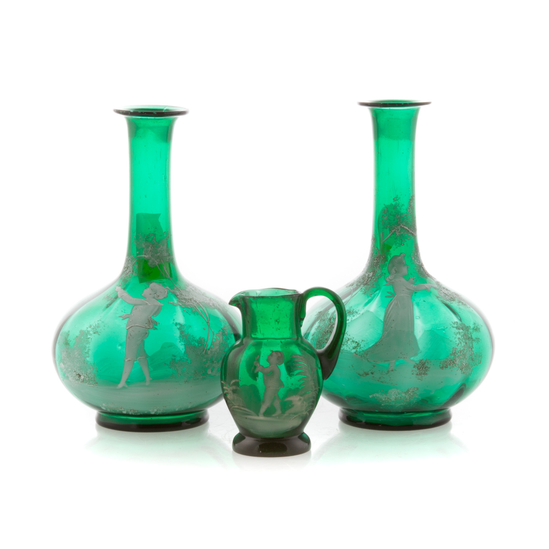 Appraisal: Three Mary Gregory emerald glass articles including pair of decanters