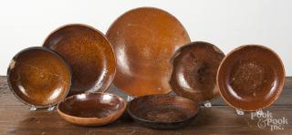 Appraisal: Twelve assorted redware plates and shallow bowls '' - ''