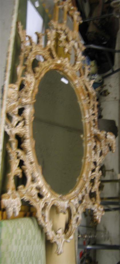 Appraisal: Chinese Chippendale style painted pine mirror The oval mirrorplate surrounded