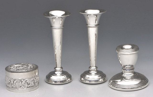 Appraisal: A PAIR OF MINIATURE SILVER ROSE VASES of tapering cylindrical