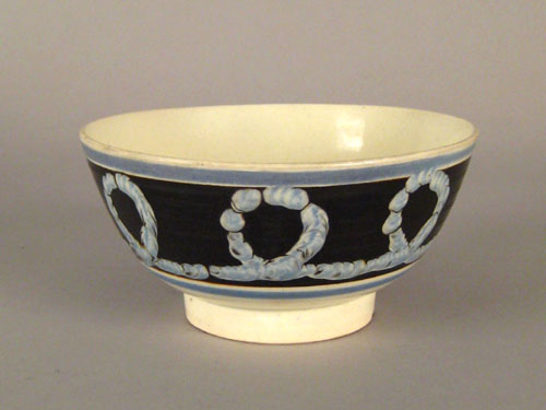 Appraisal: Mocha bowl th c with earthworm decoration on a black