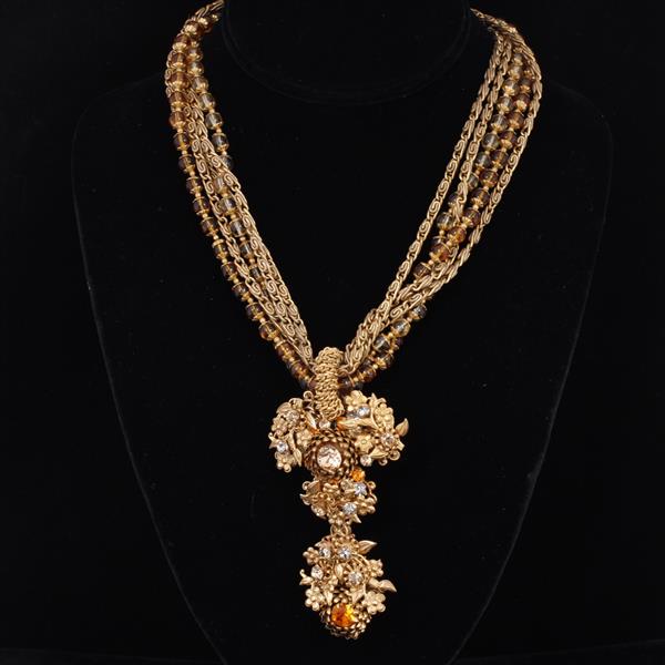 Appraisal: Amourelle Gold Tone multi strand necklace with amber colored crystals