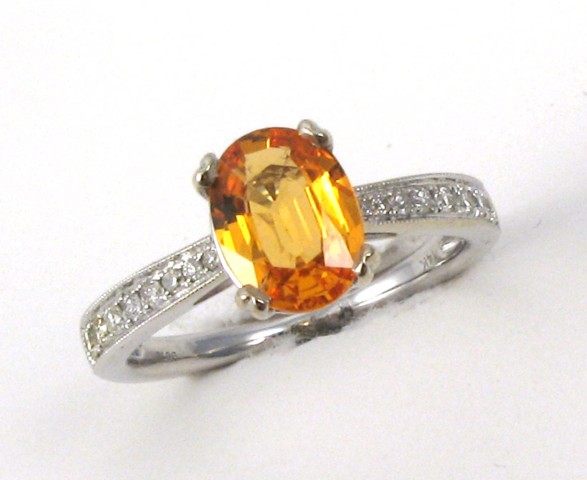 Appraisal: CITRINE AND FOURTEEN KARAT GOLD RING centering an oval-cut citrine